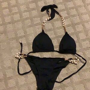 Black halter bikini with pearl embellishments